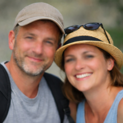 American couple smiling during a private intercity transfer service in Tuscany, Italy