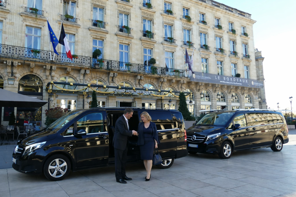 luxury vans for group transfers (7–20 passengers) parked at hotel — Florence Pisa chauffeur service
