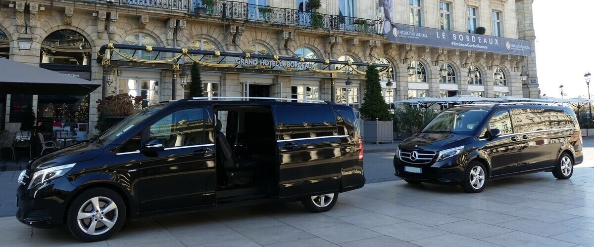 A silver Mercedes-Benz V-Class luxury van parked on a street, ideal for group airport transfers and tours in Tuscany