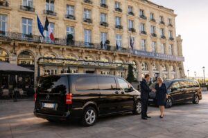 Luxury intercity transfer in Tuscany with Mercedes van in front of a premium hotel