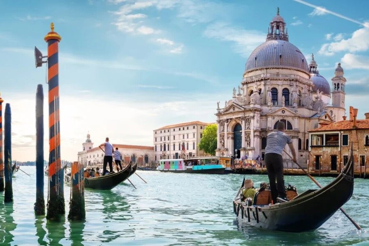 Venice gondola experience on Grand Canal with Basilica della Salute luxury travel Italy