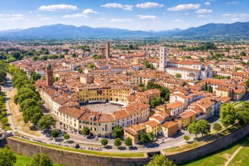 Lucca historic center aerial view on a sunny day with Renaissance walls and Piazza Anfiteatro – private airport transfer Tuscany